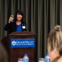 President Mantella holding up glass giving speech